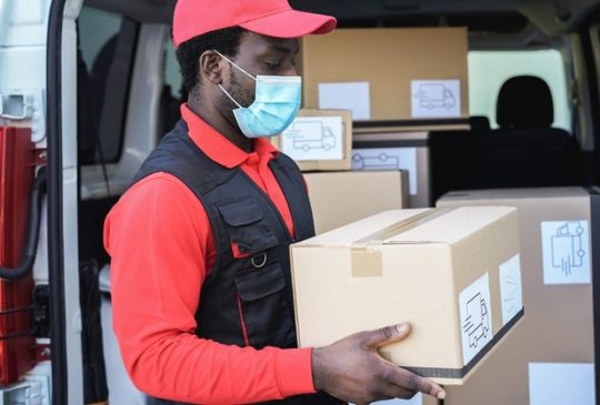 black-delivery-man-wearing-safety-mask-coronavirus-prevention-focus-face_166273-1011